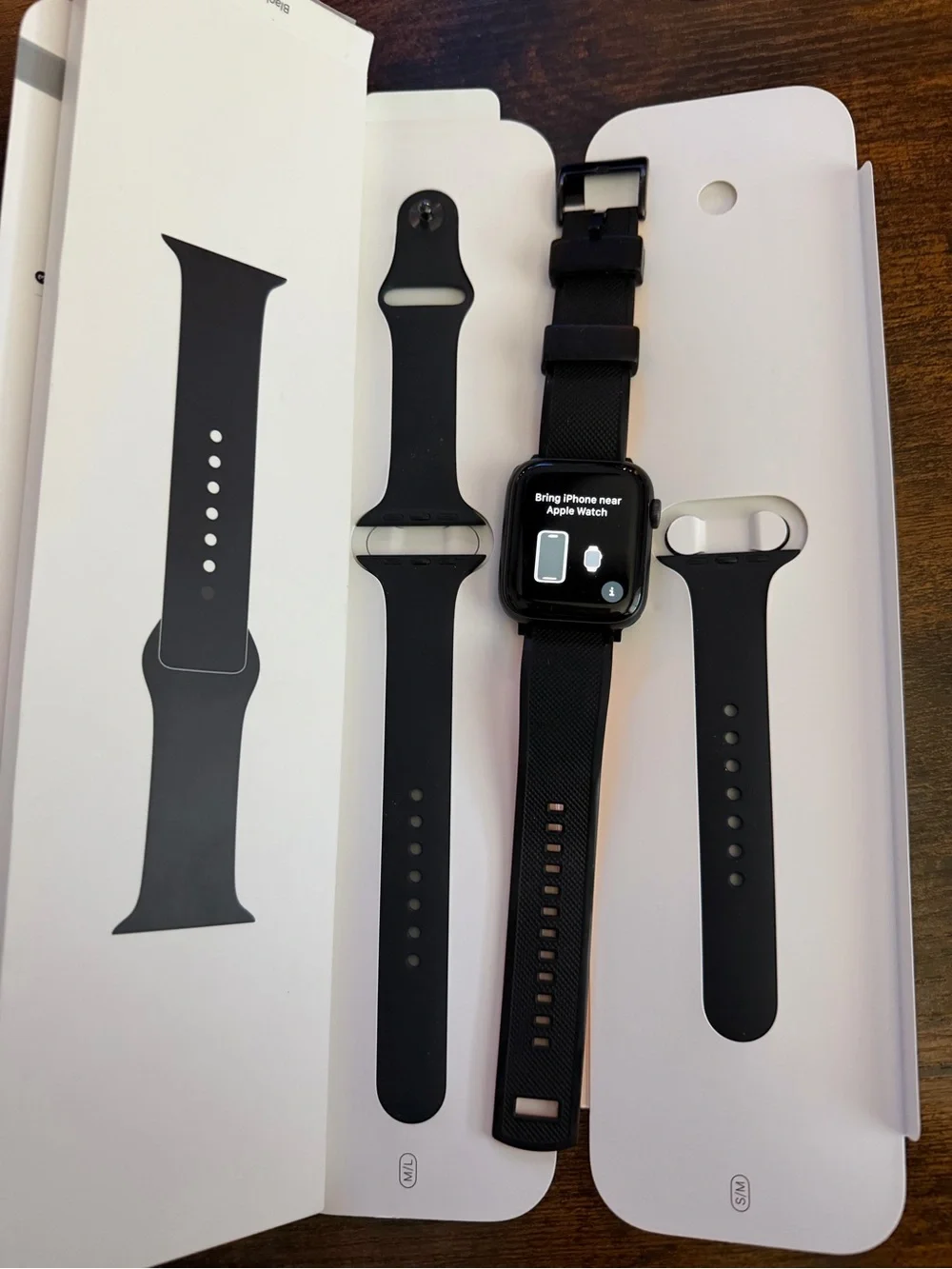 Apple Black Smartwatch with Black Silicone Band and White Magnetic Charger